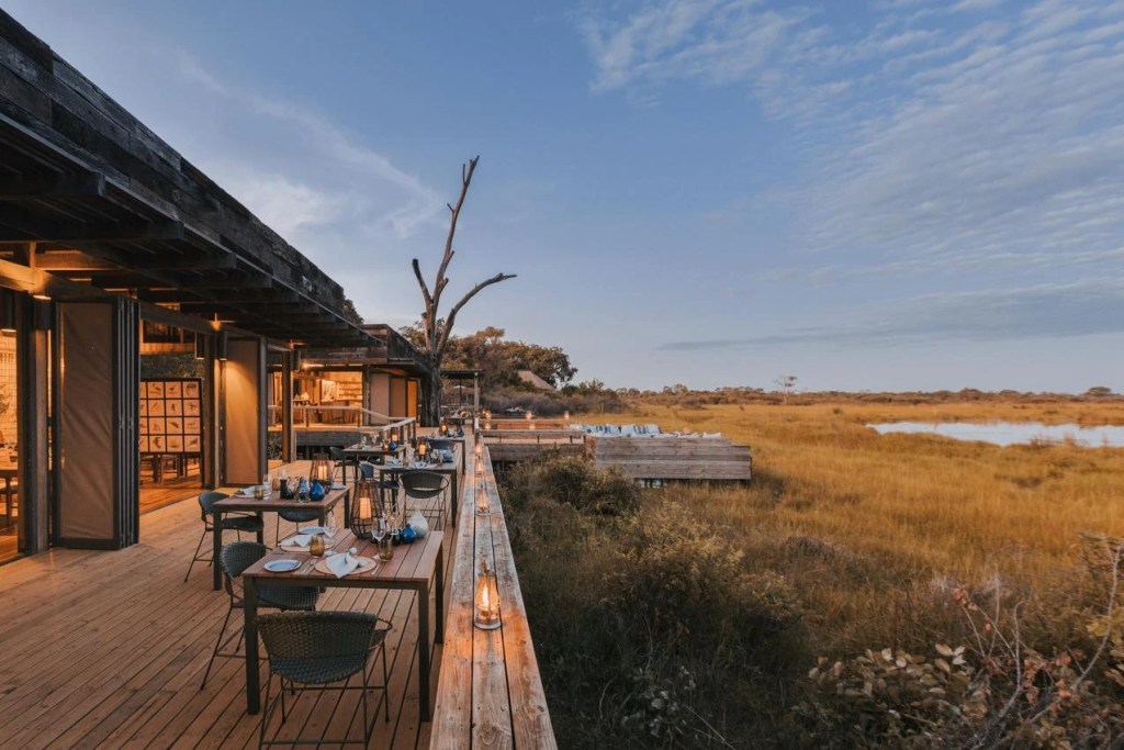 African safari lodge dining area overlooking the Okavango Delta. Photo safari in Botswana.