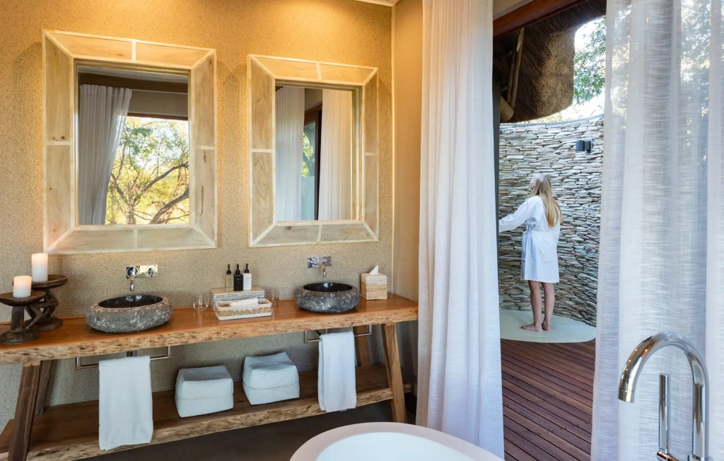 Luxury bathroom with outdoor shower, Uganda expedition photo safari