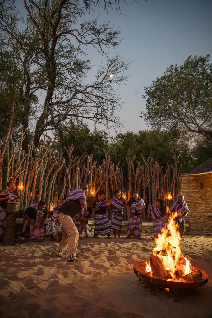 Ugandan cultural dance performance at dusk, African safari photo safari.