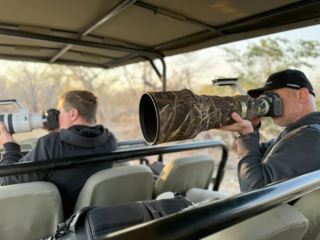 Our Team members on African photo safari, using large telephoto lenses.