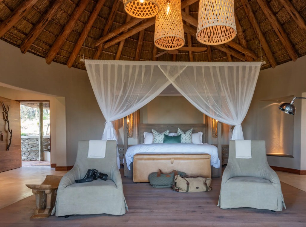 Luxury safari lodge bedroom with African safari decor, ideal for a photo safari.