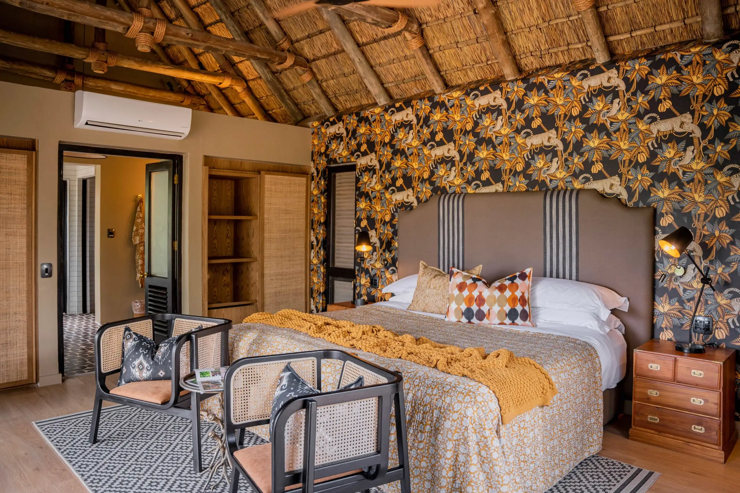 Luxury safari lodge bedroom with African animal wallpaper, Timbavuti Legacy photo safari