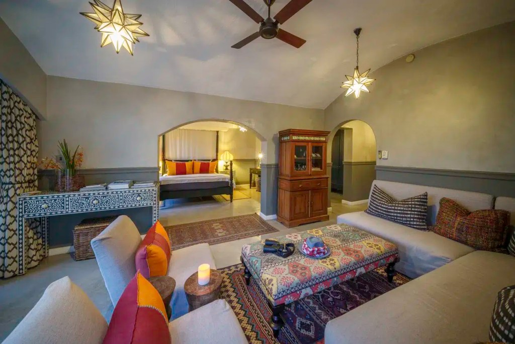 Luxury safari lodge living room and bedroom suite, Chobe Signature photo safari.