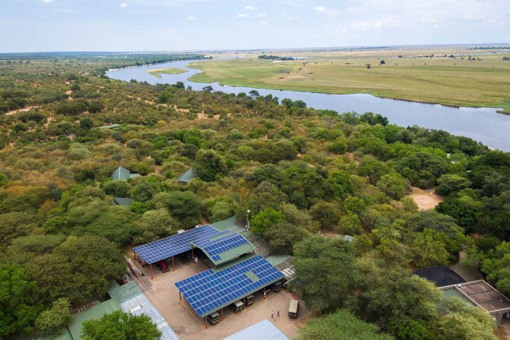 Aerial view of a safari lodge with solar panels near the Chobe River, Botswana, on an African photo safari.