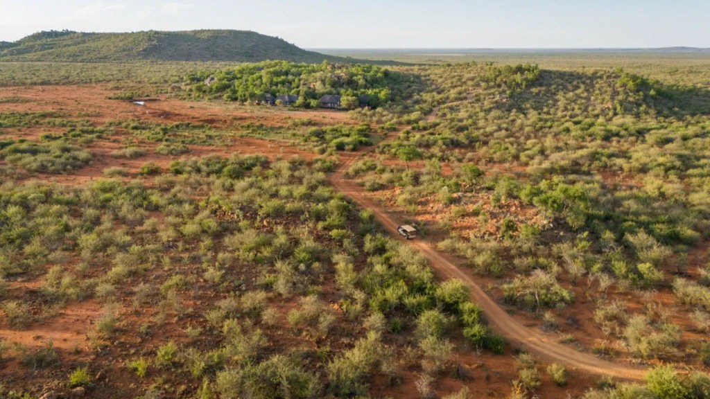 African safari lodge nestled in Madikwe landscape, photo safari adventure