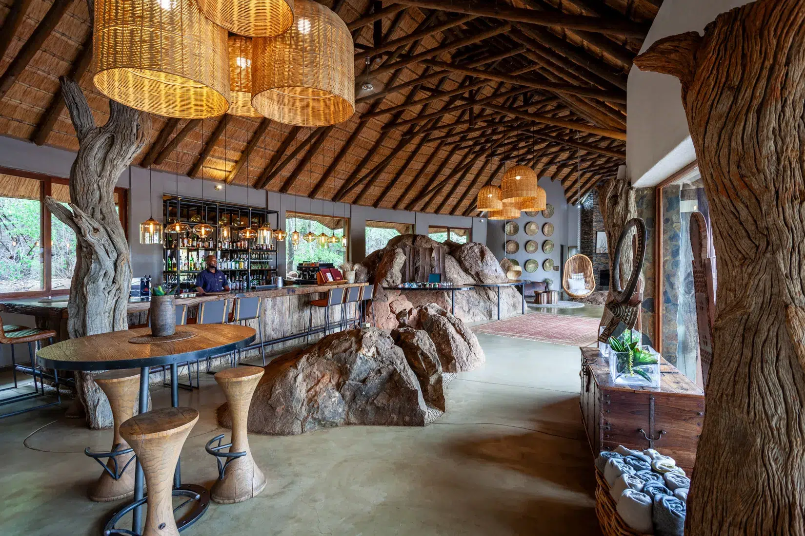 Wooden bar with stools in a Madikwe Signature lodge