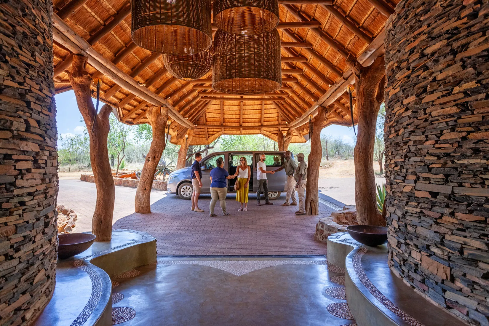 African safari guests arrive at lodge in Madikwe, South Africa.