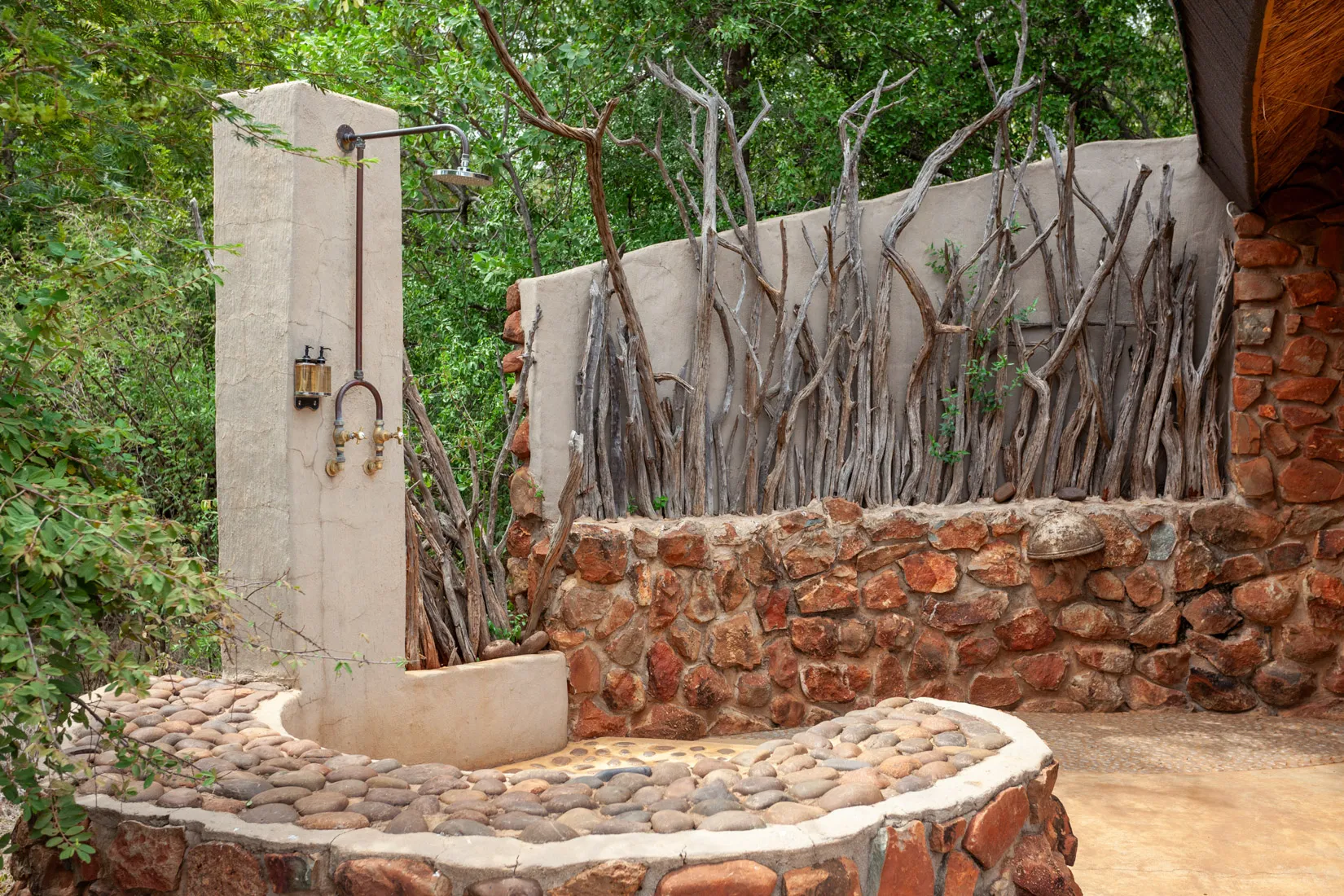 Outdoor shower at African safari lodge, perfect for a photo safari.