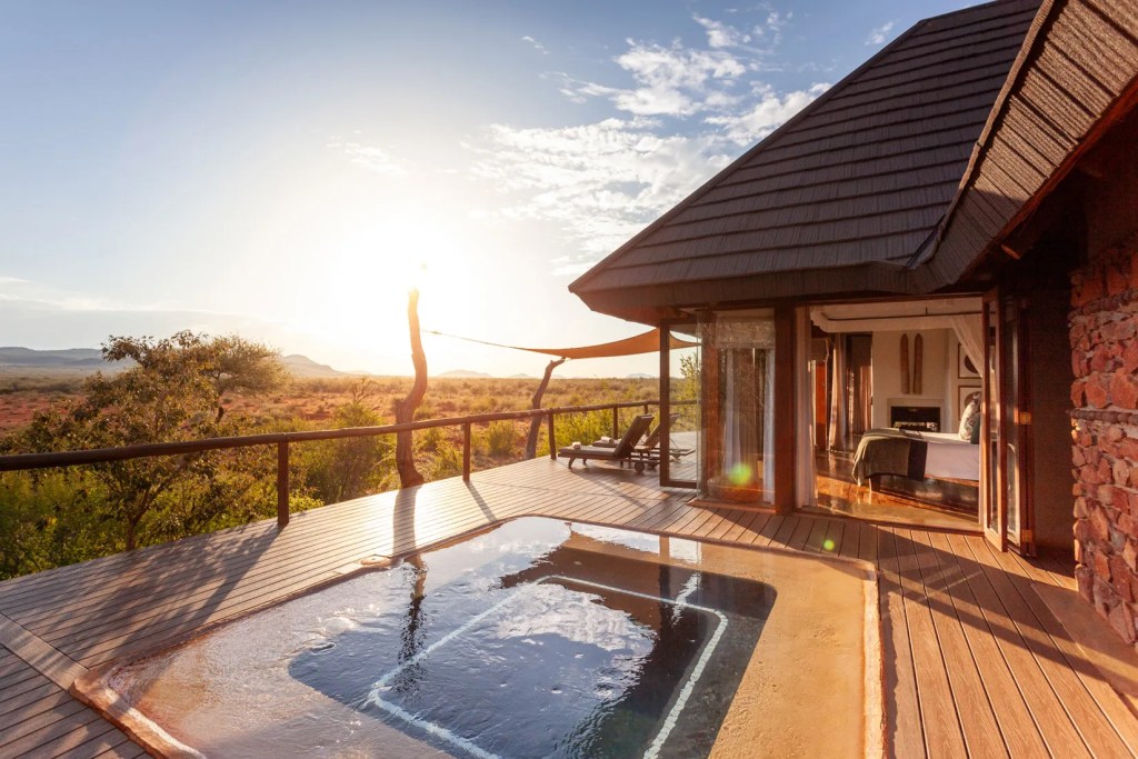 Luxury safari lodge plunge pool at sunrise, Madikwe, South Africa